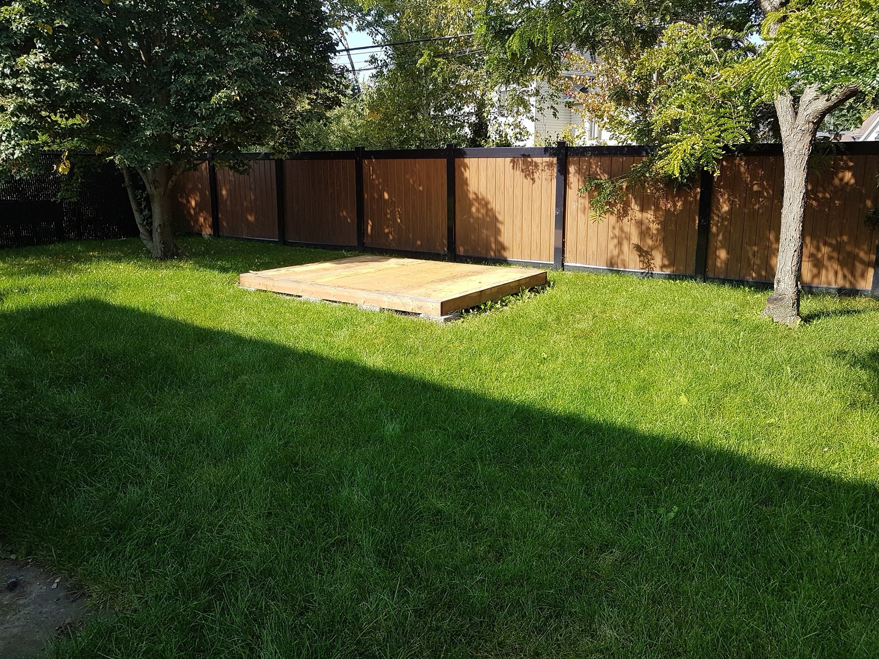 Lava and black PVC fence residential project by Williamsburg Woods and Garden, Ontario