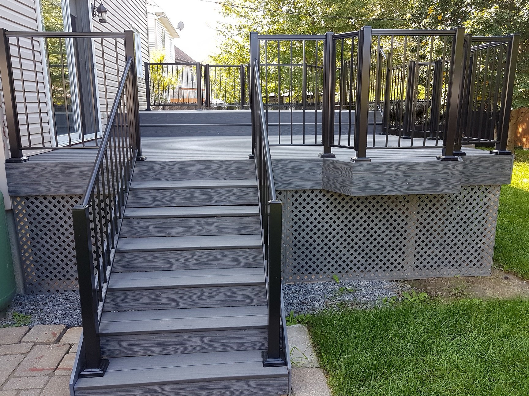 Mesa brown composite deck constructed by Williamsburg Woods and Garden, Eastern Ontario