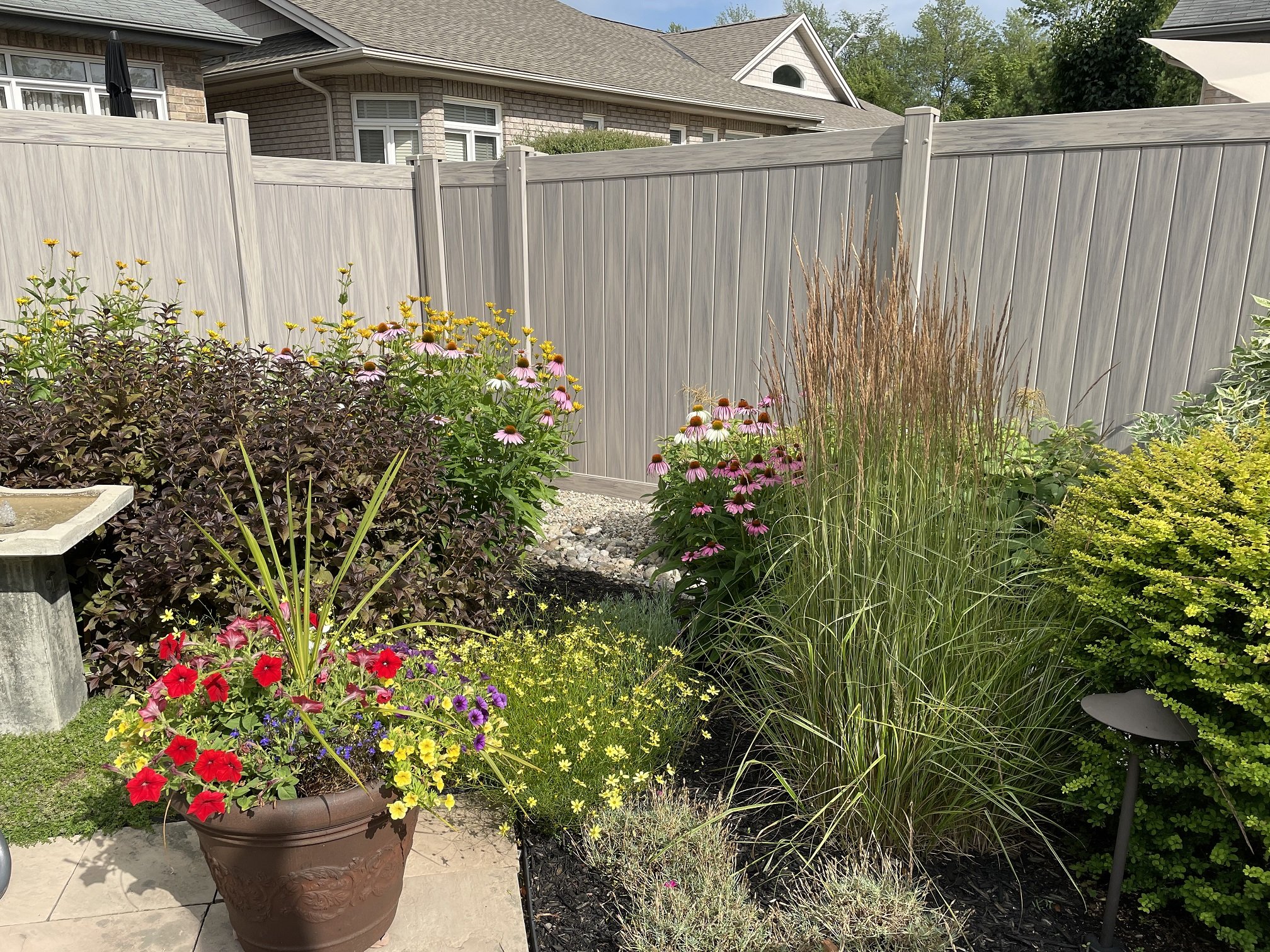 Hazelwood cedar deck with landscaping by Williamsburg Woods and Garden, Ontario