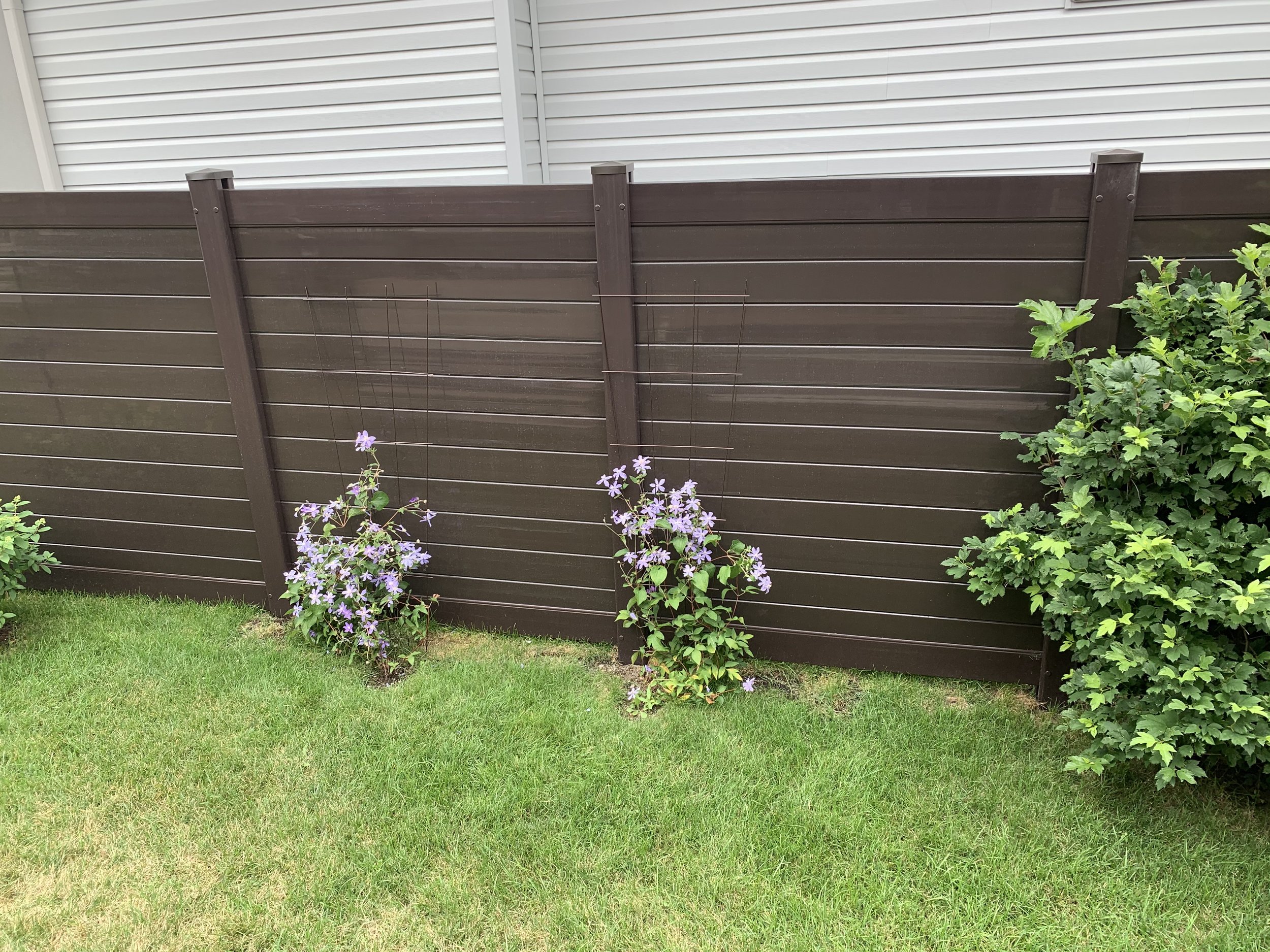 Acorn brown horizontal PVC fence project by Williamsburg Woods and Garden, Ontario