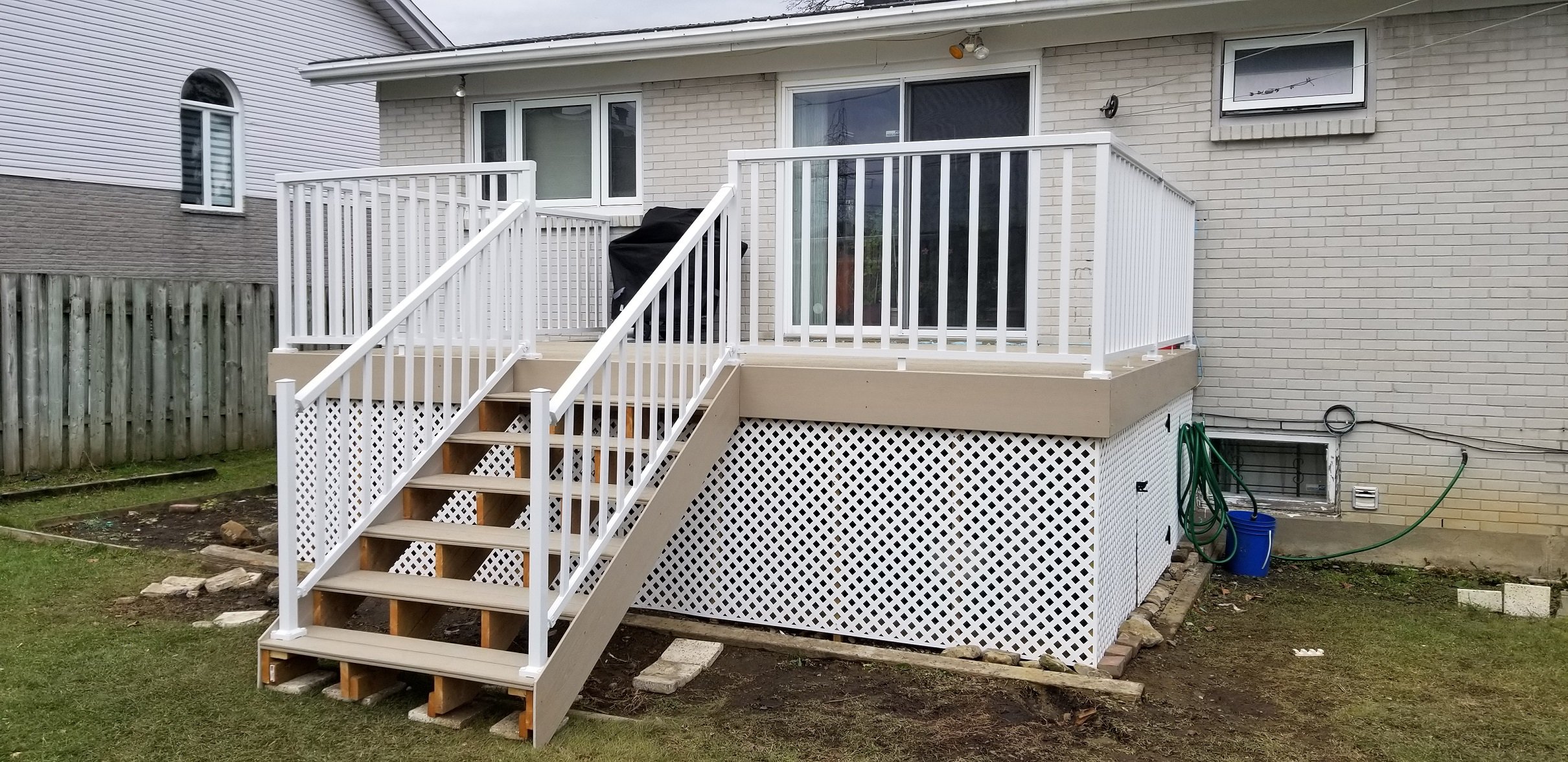 PVC deck with railing built by Williamsburg Woods and Garden, Eastern Ontario